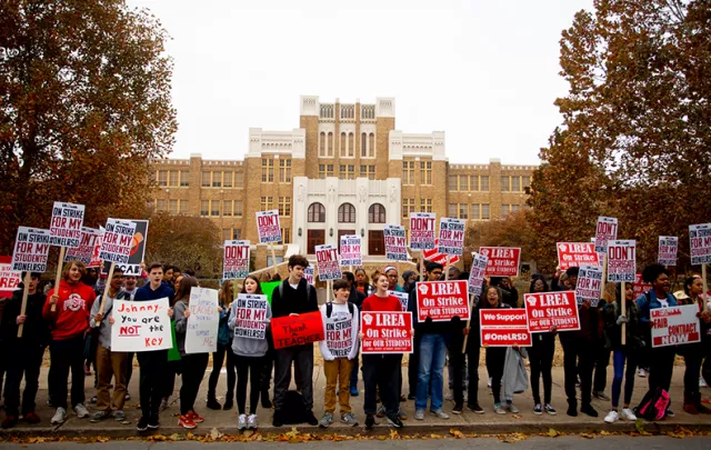Parents, Kids, and Educators on strike in front of school
