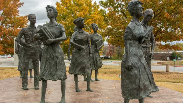 photograph of the Little Rock Nine memorial sculpture in Arkansas that features life size metal sculptures of the students