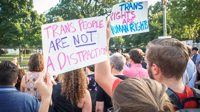 Group of people demonstrate for transgender rights in front of the White House