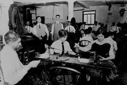 Jewish workers in a textile shop.