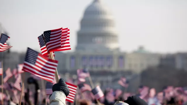 Flags being waved in front of the US Capitol
