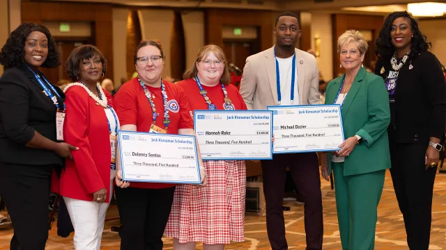 NEA-Retired president and NEA staff stand with the 2026 recipients of the Jack Kinnaman scholarship