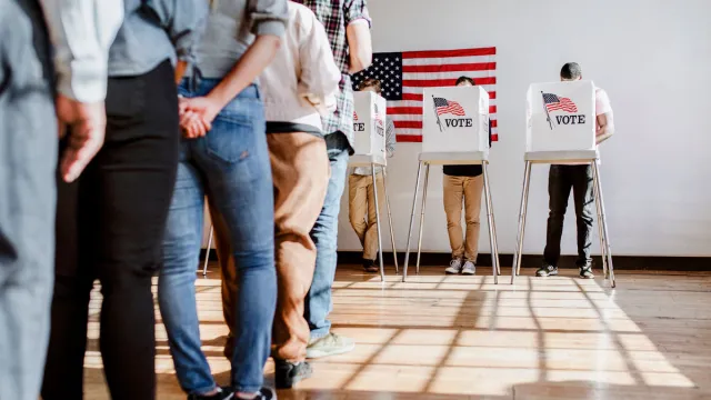 People in line to cast their vote at a polling place
