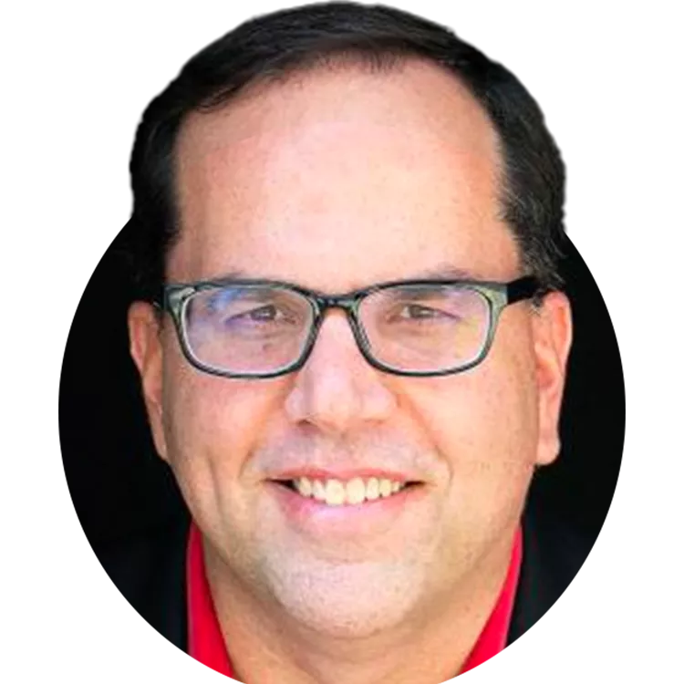 Man with glasses and dark hair smiling