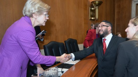 NEA member Jess Sanchez greets Senator Elizabeth Warren on Capitol Hill.
