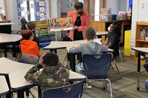 Becky Pringle reads Change Sings to 4th grade students