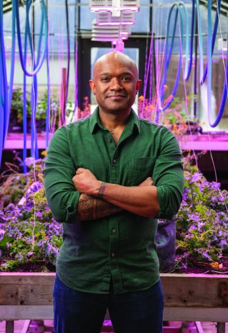 Illinois educator Jason Foster in a greenhouse