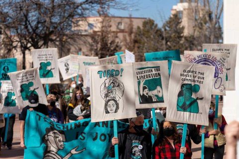 New Mexico educators rally with handmade banners