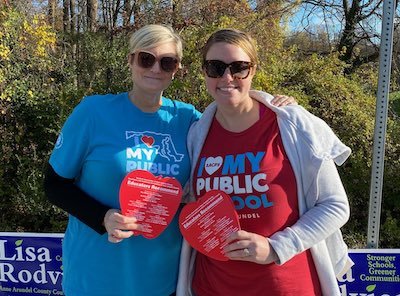 Maryland educators in pro-public education T-shirts distribute info before the election