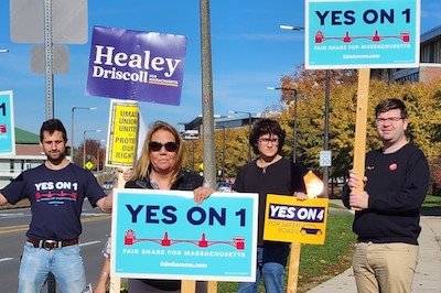 Massachusetts Teachers Association members hold election signs