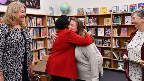 NEA President Becky Pringle hugs Read Across content winner and teacher Megan Sterling