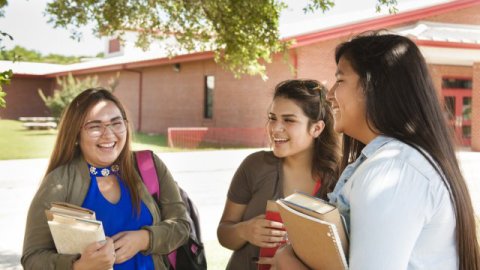 american indian girls chat at school