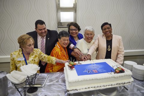 NEA and NEA-Retired leaders cut a 40th Anniversary cake at the NEA-Retired Annual Meeting.