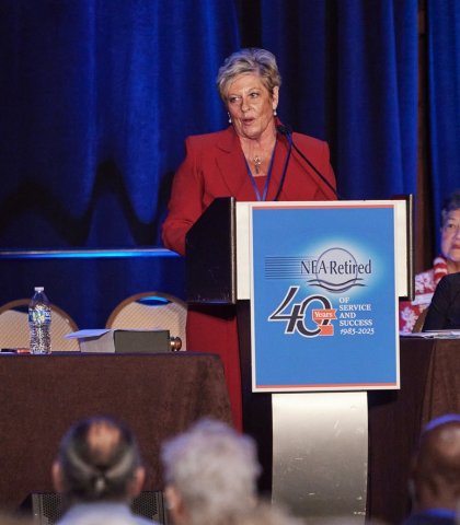NEA-Retired President-Elect Anita Gibson at podium addressing 2023 Retired Annual Meeting
