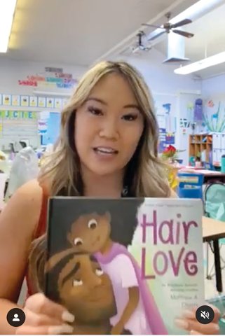 screencapture of Kelsey Vidal's post on Instagram She holds a copy of the book Hair Love