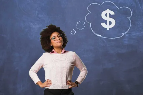 Black female with a thought bubble of a dollar sign on a blue background.