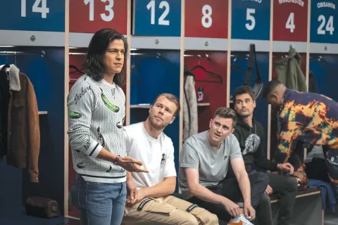 AFC Richmond team locker room with Cristo Fernández as Dani Rojas speaking to the team. David Elsendoorn as Jan Maas, Billy Harris as Colin Hughes, and Kola Bokinni as Isaac McAdoo.
